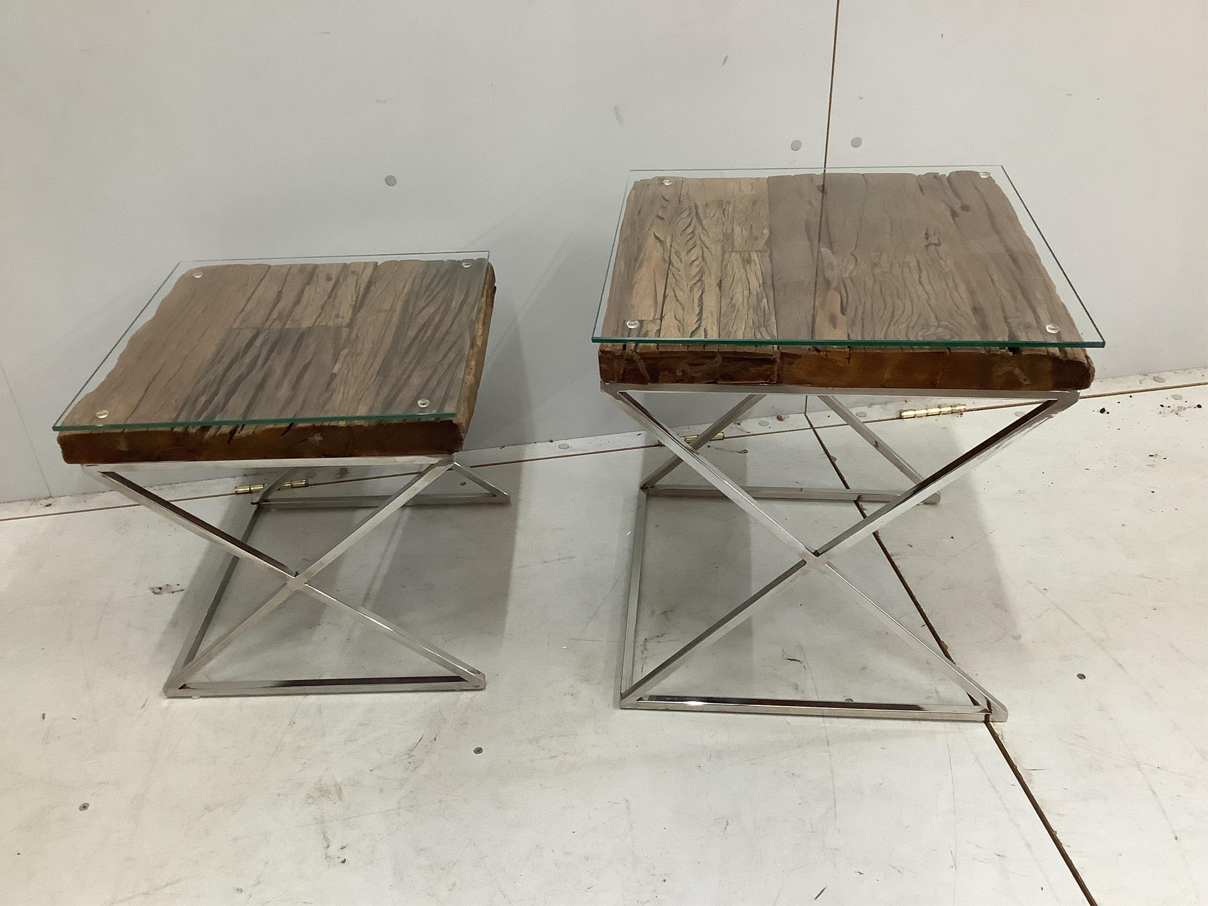 A stepped pair of Contemporary weathered timber and chrome occasional tables, the tops made from old train rail track woods largest width 45cm, height 44cm. Condition - good